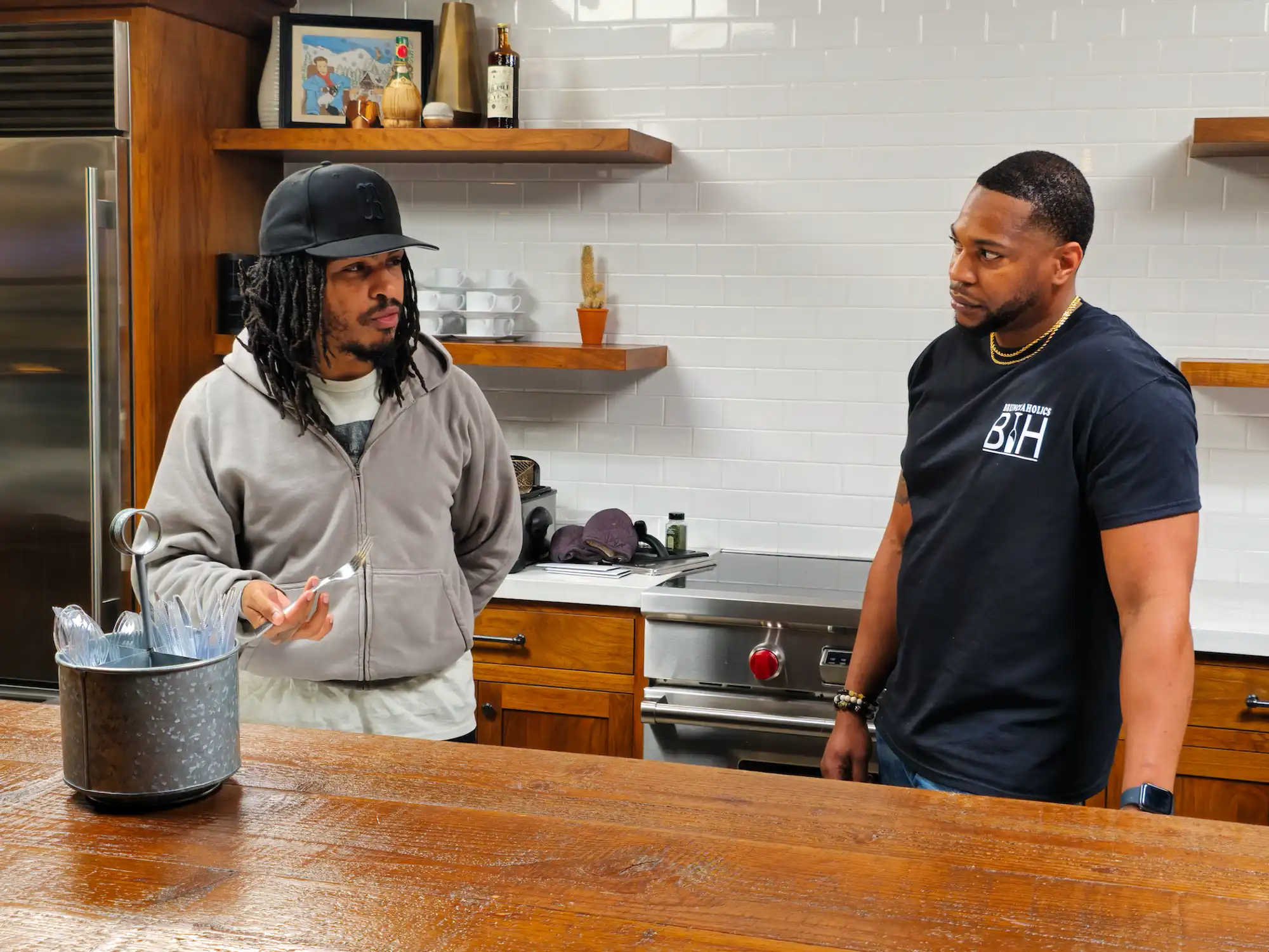 Keith Lee meeting a restaurant owner in a professional kitchen